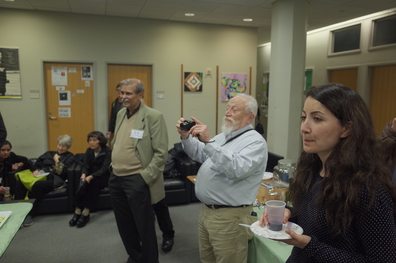 Rohit Listening to Informal Speeches During Wine and Cheese
